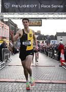 6 April 2023; Eoin Everard of Kilkenny City Harriers crosses the line to finish fourth in the Peugeot Race Series - Streets of Kilkenny 2023 in Kilkenny. Photo by Sam Barnes/Sportsfile