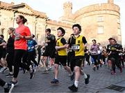 6 April 2023; Brothers Cody, left, and Zach Butler of Kilkenny City Harriers pass Kilkenny Castle during the Peugeot Race Series - Streets of Kilkenny 2023 in Kilkenny. Photo by Sam Barnes/Sportsfile
