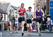 6 April 2023; Athletes, from left, Ide Nic Dhomhnaill of West Limerick AC,  James Hayes of Cork Track AC, Patrick Hickey of Rathfarnham WSAF AC and Denis Whelan of Slaney Olympic AC  compete in the Peugeot Race Series - Streets of Kilkenny 2023 in Kilkenny. Photo by Sam Barnes/Sportsfile