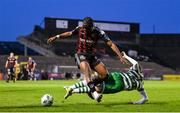 7 April 2023; Jonathan Afolabi of Bohemians is tackled by Dylan Watts of Shamrock Rovers during the SSE Airtricity Men's Premier Division match between Bohemians and Shamrock Rovers at Dalymount Park in Dublin. Photo by Seb Daly/Sportsfile