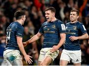 7 April 2023; Jimmy O'Brien of Leinster celebrates with teammates Garry Ringrose and Luke McGrath after scoring his side's sixth try during the Heineken Champions Cup quarter-final match between Leinster and Leicester Tigers at the Aviva Stadium in Dublin. Photo by Harry Murphy/Sportsfile