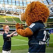 7 April 2023; Match day mascot Max Quinlan with Leinster mascot Leo the Lion during the Activities at the Heineken Champions Cup Quarter-Final match between Leinster and Leicester Tigers at Aviva Stadium in Dublin. Photo by Harry Murphy/Sportsfile