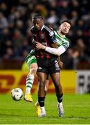 7 April 2023; Jonathan Afolabi of Bohemians in action against Neil Farrugia of Shamrock Rovers during the SSE Airtricity Men's Premier Division match between Bohemians and Shamrock Rovers at Dalymount Park in Dublin. Photo by Seb Daly/Sportsfile