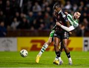 7 April 2023; Jonathan Afolabi of Bohemians in action against Neil Farrugia of Shamrock Rovers during the SSE Airtricity Men's Premier Division match between Bohemians and Shamrock Rovers at Dalymount Park in Dublin. Photo by Seb Daly/Sportsfile