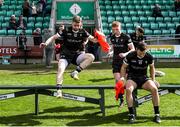 8 April 2023; Keelan Cawley of Sligo, 10, leaps over the bench for the team photo before the Connacht GAA Football Senior Championship Quarter-Final match between London and Sligo at McGovern Park in Ruislip, London. Photo by Matt Impey/Sportsfile