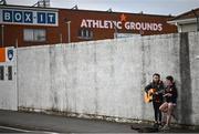 8 April 2023; Armagh supporters Gracie Clarke, age 10, left, and Aoife Rafferty, age 9, busking outside the ground before the Ulster GAA Football Senior Championship preliminary round match between Armagh and Antrim at Box-It Athletic Grounds in Armagh. Photo by Ramsey Cardy/Sportsfile