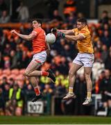 8 April 2023; Patrick McBride of Antrim in action against Rory Grugan of Armagh during the Ulster GAA Football Senior Championship preliminary round match between Armagh and Antrim at Box-It Athletic Grounds in Armagh. Photo by Ramsey Cardy/Sportsfile