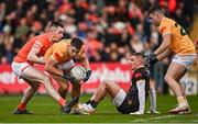 8 April 2023; Eoghan McCabe of Antrim in action against Shane McPartlan of Armagh during the Ulster GAA Football Senior Championship preliminary round match between Armagh and Antrim at Box-It Athletic Grounds in Armagh. Photo by Ramsey Cardy/Sportsfile