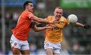 8 April 2023; Stefan Campbell of Armagh in action against Marc Jordan of Antrim during the Ulster GAA Football Senior Championship preliminary round match between Armagh and Antrim at Box-It Athletic Grounds in Armagh. Photo by Ramsey Cardy/Sportsfile