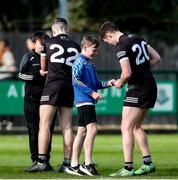 8 April 2023; Young supporters on the pitch getting autographs of the Sligo players after the Connacht GAA Football Senior Championship Quarter-Final match between London and Sligo at McGovern Park in Ruislip, London. Photo by Matt Impey/Sportsfile