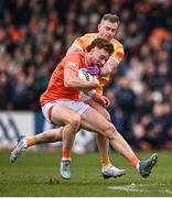 8 April 2023; Jason Duffy of Armagh in action against Patrick McBride of Antrim during the Ulster GAA Football Senior Championship preliminary round match between Armagh and Antrim at Box-It Athletic Grounds in Armagh. Photo by Ramsey Cardy/Sportsfile