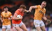 8 April 2023; Jason Duffy of Armagh in action against Marc Jordan of Antrim during the Ulster GAA Football Senior Championship preliminary round match between Armagh and Antrim at Box-It Athletic Grounds in Armagh. Photo by Ramsey Cardy/Sportsfile