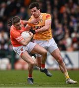 8 April 2023; Greg McCabe of Armagh in action against Patrick Finnegan of Antrim during the Ulster GAA Football Senior Championship preliminary round match between Armagh and Antrim at Box-It Athletic Grounds in Armagh. Photo by Ramsey Cardy/Sportsfile