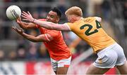 8 April 2023; Jemar Hall of Armagh in action against Pat Shivers of Antrim during the Ulster GAA Football Senior Championship preliminary round match between Armagh and Antrim at Box-It Athletic Grounds in Armagh. Photo by Ramsey Cardy/Sportsfile