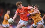 8 April 2023; Conor Turbitt of Armagh in action against Peter Healy of Antrim  during the Ulster GAA Football Senior Championship preliminary round match between Armagh and Antrim at Box-It Athletic Grounds in Armagh. Photo by Ramsey Cardy/Sportsfile