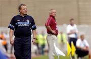 6 June 2004; Tommy Lyons, left, Dublin manager, and Westmeath manager Paidi O'Se keep a close eye on the game. Bank of Ireland Leinster Senior Football Championship, Dublin v Westmeath, Croke Park, Dublin. Picture credit; Matt Browne / SPORTSFILE