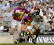 6 June 2004; Paddy Colfer, Wexford, in action against Brian Lacey, Kildare. Bank of Ireland Leinster Senior Football Championship, Wexford v Kildare, Croke Park, Dublin. Picture credit; Matt Browne / SPORTSFILE