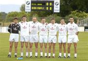 12 June 2004; The Kildare defence of, from left, Enda Murphy, Michael Foley, Glenn Ryan, Damien Hendy, Eamonn Callaghan, Andrew McLoughlin and Rob McCabe, stand together for the National Anthem before the game. Bank of Ireland Football Championship Qualifier, Round 1, Kildare v Offaly, St. Conleth's Park, Newbridge, Co. Kildare. Picture credit; Brendan Moran / SPORTSFILE