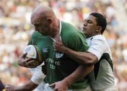 19 June 2004; John Hayes, Ireland, is tackled by Breyton Paulse, South Africa. South Africa Tour June 2004, South Africa v Ireland, 2nd test, Newlands Stadium, Cape Town, South Africa. Picture credit; Matt Browne / SPORTSFILE