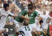 19 June 2004; Kevin Maggs, Ireland, is tackled by Percy Montgomery, 15, and Jacques Cronje, South Africa. South Africa Tour June 2004, South Africa v Ireland, 2nd test, Newlands Stadium, Cape Town, South Africa. Picture credit; Matt Browne / SPORTSFILE
