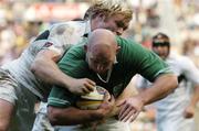 19 June 2004; John Hayes, Ireland, is tackled by Schalk Burger, South Africa. South Africa Tour June 2004, South Africa v Ireland, 2nd test, Newlands Stadium, Cape Town, South Africa. Picture credit; Matt Browne / SPORTSFILE