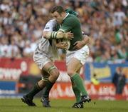 19 June 2004; Kevin Maggs, Ireland, is tackled by Bakkies Botha, South Africa. South Africa Tour June 2004, South Africa v Ireland, 2nd test, Newlands Stadium, Cape Town, South Africa. Picture credit; Matt Browne / SPORTSFILE