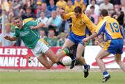 20 June 2004; Jimmy Guckian, Leitrim, in action against John Whyte and Andy McPadden, 19,  Roscommon. Bank of Ireland Connacht Senior Football Championship Semi-Final, Leitrim v Roscommon, O'Moore Park, Carrick-on-Shannon, Co. Leitrim. Picture credit; David Maher / SPORTSFILE