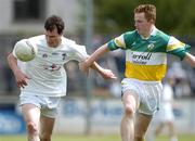 12 June 2004; Michael Foley, Kildare, in action against Pascal Kellaghan, Offaly. Bank of Ireland Football Championship Qualifier, Round 1, Kildare v Offaly, St. Conleth's Park, Newbridge, Co. Kildare. Picture credit; Brendan Moran / SPORTSFILE
