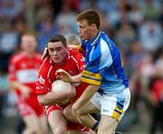 12 June 2004; Jim Kelly, Derry, in action against Thomas Burke, Wicklow. Bank of Ireland Football Championship Qualifier, Round 1, Wicklow v Derry, County Grounds, Aughrim, Co. Wicklow. Picture credit; David Maher / SPORTSFILE