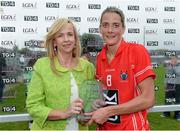 24 August 2013; Helen O'Rourke, Chief Executive Ladies Football Association presents Juliet Murphy, Cork, with her player of the match trophy. TG4 All-Ireland Ladies Football Senior Championship Quarter-Final, Cork v Dublin, St. Brendan's Park, Birr, Co. Offaly. Picture credit: Matt Browne / SPORTSFILE