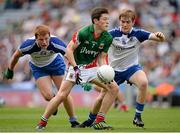 25 August 2013; Seán Conlon, Mayo, clears under pressure from Mark Magee, left and Ferghal McMahon, Monaghan. Electric Ireland GAA Football All-Ireland Minor Championship Semi-Final, Mayo v Monaghan, Croke Park, Dublin. Picture credit: Ray McManus / SPORTSFILE