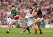 25 August 2013; Mark Donnelly, Tyrone, in action against Enda Varley, left, and Seamus O'Shea, Mayo. GAA Football All-Ireland Senior Championship Semi-Final, Mayo v Tyrone, Croke Park, Dublin. Picture credit: Stephen McCarthy / SPORTSFILE