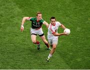 25 August 2013; Mark Donnelly, Tyrone, in action against Donal Vaughan, Mayo. GAA Football All-Ireland Senior Championship Semi-Final, Mayo v Tyrone, Croke Park, Dublin. Picture credit: Dáire Brennan / SPORTSFILE