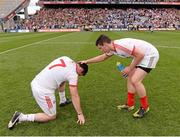 25 August 2013; Conor Gormley, left, Tyrone, is comforted by Mayo's Alan Freeman, wearing a Tyrone jersey, after the game. GAA Football All-Ireland Senior Championship Semi-Final, Mayo v Tyrone, Croke Park, Dublin. Picture credit: Ray McManus / SPORTSFILE