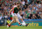 25 August 2013; Colm Boyle, Mayo, is fouled by Tyrone substitute Dermot Carlin which resulted in a penalty being awarded. GAA Football All-Ireland Senior Championship Semi-Final, Mayo v Tyrone, Croke Park, Dublin. Picture credit: Ray McManus / SPORTSFILE