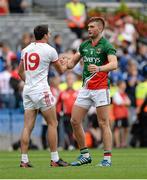 25 August 2013; AIdan O'Shea, Mayo, and Kyle Coney, Tyrone at the final whistle. GAA Football All-Ireland Senior Championship Semi-Final, Mayo v Tyrone, Croke Park, Dublin. Picture credit: Oliver McVeigh / SPORTSFILE