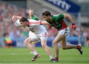 25 August 2013; Connor McAliskey, Tyrone, in action against Ger Cafferkey, Mayo. GAA Football All-Ireland Senior Championship Semi-Final, Mayo v Tyrone, Croke Park, Dublin. Picture credit: Oliver McVeigh / SPORTSFILE