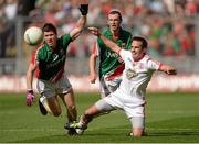 25 August 2013; Mark Donnelly, Tyrone, in action against Enda Varley and Keith Higgins, Mayo. GAA Football All-Ireland Senior Championship Semi-Final, Mayo v Tyrone, Croke Park, Dublin. Picture credit: Oliver McVeigh / SPORTSFILE