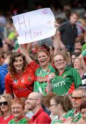 25 August 2013; Mayo supporters Nuala Connolly, centre, from Kilmaine, and her friends Laura Muldoon, from Mulranny, and Hanna Callaghan, from Achil, send good wishes to their mother's in the Davin stand of Croke Park. GAA Football All-Ireland Senior Championship Semi-Final, Mayo v Tyrone, Croke Park, Dublin. Picture credit: Ray McManus / SPORTSFILE