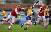 9 April 2023; Padraic Collins of Clare in action against in action against Steven Sherlock of Cork during the Munster GAA Football Senior Championship Quarter-Final match between Clare and Cork at Cusack Park in Ennis, Clare. Photo by Piaras Ó Mídheach/Sportsfile