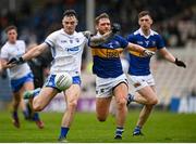 9 April 2023; Darragh Corcoran of Waterford in action against Colm O'Shaughnessy of Tipperary during the Munster GAA Football Senior Championship Quarter-Final match between Tipperary and Waterford at FBD Semple Stadium in Thurles, Tipperary. Photo by Stephen Marken/Sportsfile