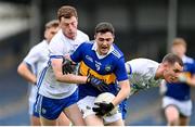 9 April 2023; Conor Cadell of Tipperary in action against Michael Curry of Waterford during the Munster GAA Football Senior Championship Quarter-Final match between Tipperary and Waterford at FBD Semple Stadium in Thurles, Tipperary. Photo by Stephen Marken/Sportsfile