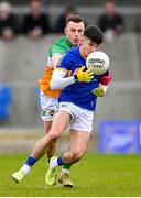 9 April 2023; Iarla O'Sullivan of Longford in action against Cian Farrell of Offaly during the Leinster GAA Football Senior Championship Round 1 match between Longford and Offaly at Glennon Brothers Pearse Park in Longford. Photo by Ray McManus/Sportsfile