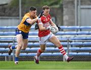 9 April 2023; Steven Sherlock of Cork in action against Jamie Malone of Clare during the Munster GAA Football Senior Championship Quarter-Final match between Clare and Cork at Cusack Park in Ennis, Clare. Photo by Piaras Ó Mídheach/Sportsfile
