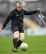 9 April 2023; Linesman Jonathon Hayes clears a spare ball off the pitch before the start of the second half of the Munster GAA Football Senior Championship Quarter-Final match between Clare and Cork at Cusack Park in Ennis, Clare. Photo by Piaras Ó Mídheach/Sportsfile