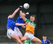 9 April 2023; Jack McEvoy of Offaly in action against Michael Quinn and Jack Macken of Longford, left, during the Leinster GAA Football Senior Championship Round 1 match between Longford and Offaly at Glennon Brothers Pearse Park in Longford. Photo by Ray McManus/Sportsfile