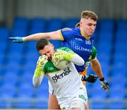 9 April 2023; Offaly goalkeeper Ian Duffy is tackled by Daire O'Brien of Longford during the Leinster GAA Football Senior Championship Round 1 match between Longford and Offaly at Glennon Brothers Pearse Park in Longford. Photo by Ray McManus/Sportsfile