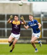 9 April 2023; Paraic Hughes of Wexford in action against Sean O'Flynn of Laois during the Leinster GAA Football Senior Championship Round 1 match between Laois and Wexford at Laois Hire O'Moore Park in Portlaoise, Laois. Photo by Tom Beary/Sportsfile