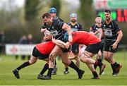 9 April 2023; David O'Connor of Kilkenny is tackled by Ross Dooley, left, and Conor Smyth of Cill Dara during the Bank of Ireland Provincial Towns Cup Semi-Final match between Kilkenny RFC and Cill Dara RFC at Portlaoise RFC in Portlaoise, Laois. Photo by Ben McShane/Sportsfile