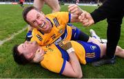 9 April 2023; Clare players Keelan Sexton, 13, and Eoin Cleary celebrate after their side's victory in the Munster GAA Football Senior Championship Quarter-Final match between Clare and Cork at Cusack Park in Ennis, Clare. Photo by Piaras Ó Mídheach/Sportsfile